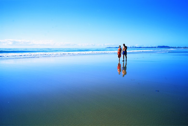 couple walking along beach